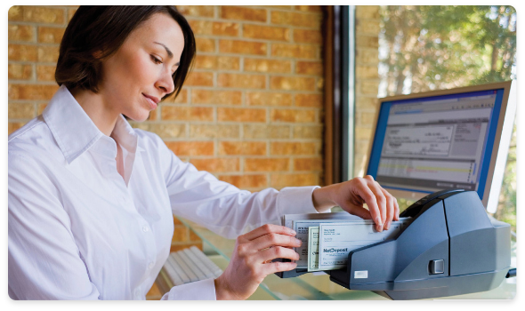 A woman scanning checks